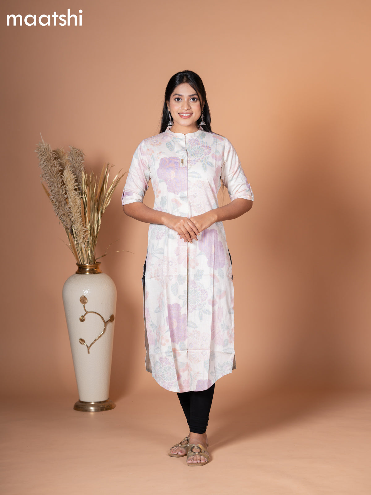 Rayon kurti off white with allover leaf prints & simple neck pattern without pant