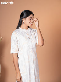 Rayon kurti cream with allover floral prints & simple neck pattern without pant