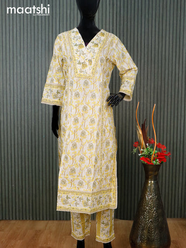 Cotton readymade salwar suit cream and yellow with allover floral prints & v neck pattern and straight cut pant & dupatta