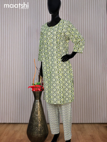 Cotton readymade kurti set sap green and off white with allover ikat prints & simple neck pattern and straight cut pant