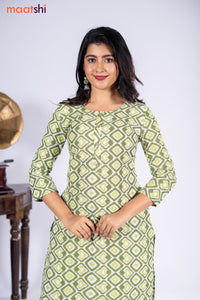 Cotton kurti sap green and off white with allover ikat prints & simple neck pattern and straight cut pant