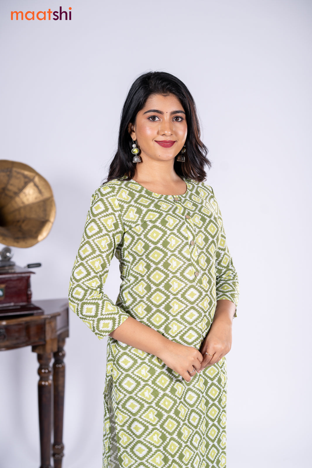 Cotton kurti sap green and off white with allover ikat prints & simple neck pattern and straight cut pant