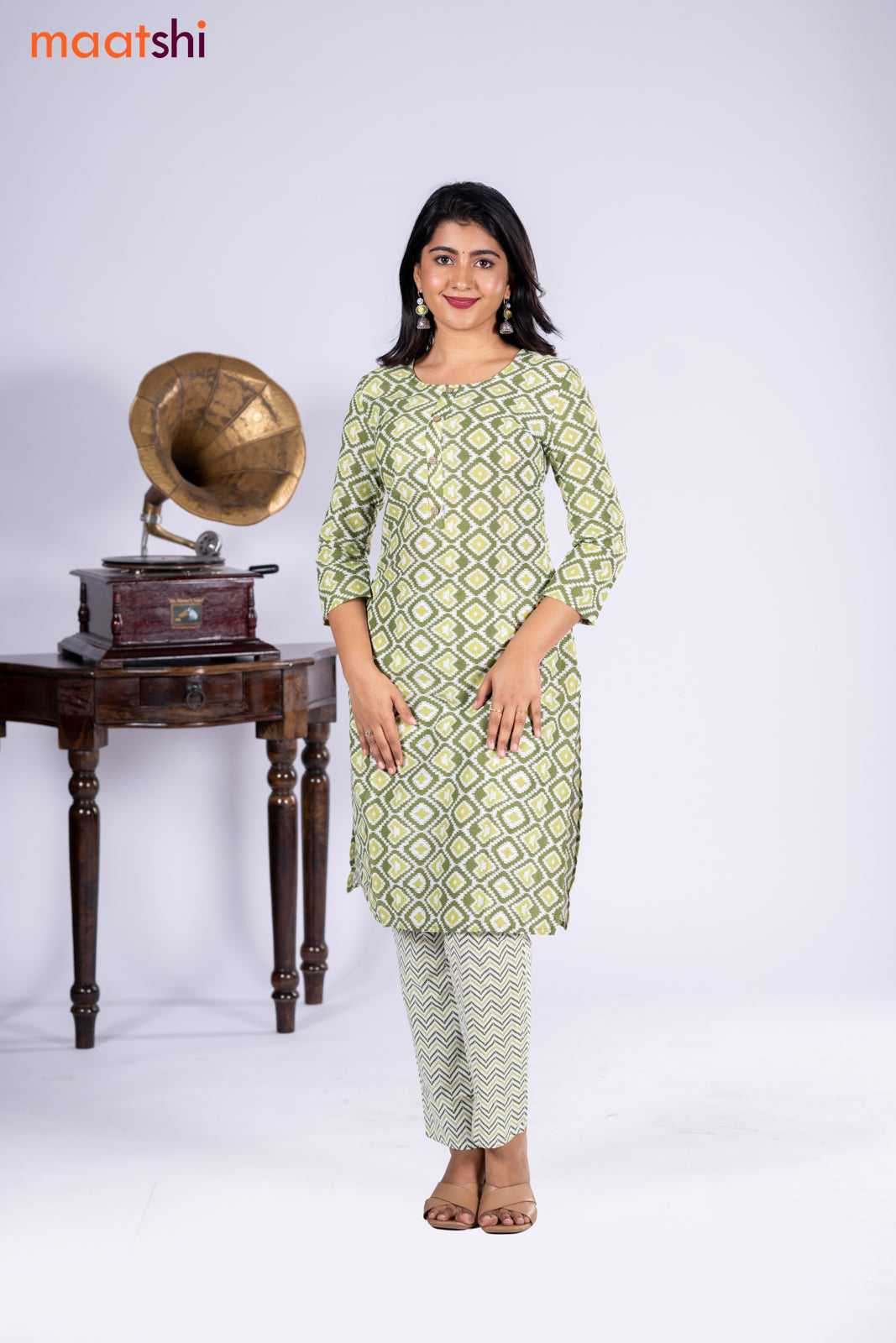 Cotton kurti sap green and off white with allover ikat prints & simple neck pattern and straight cut pant