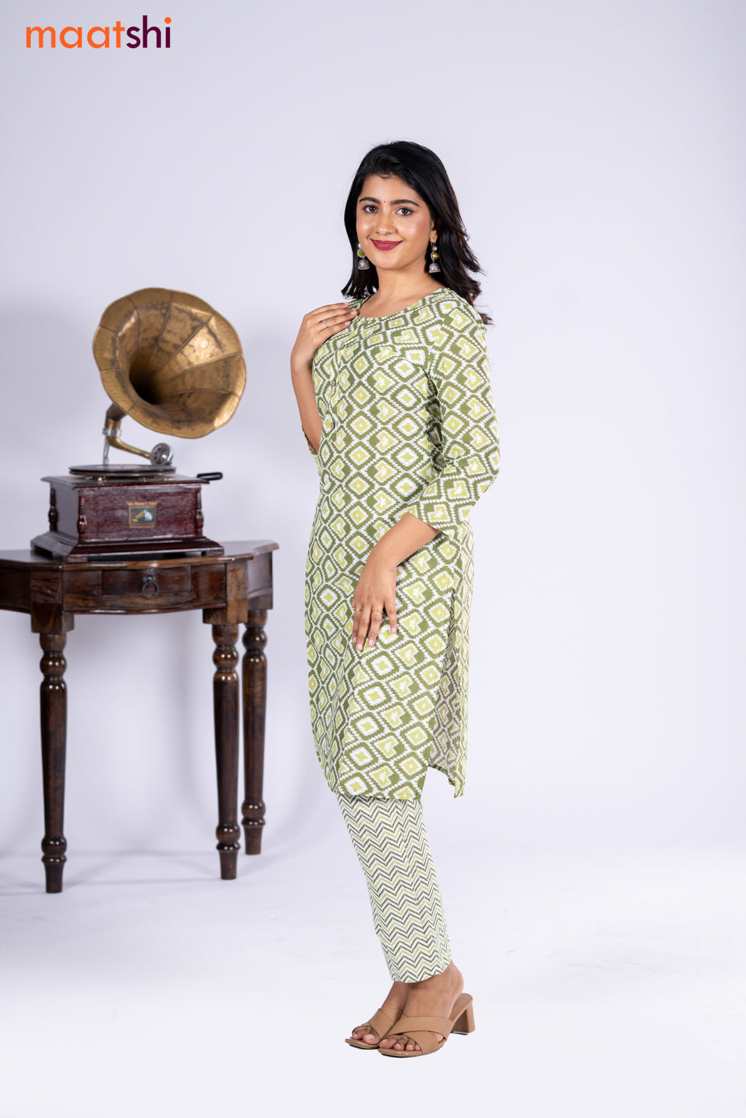 Cotton kurti sap green and off white with allover ikat prints & simple neck pattern and straight cut pant