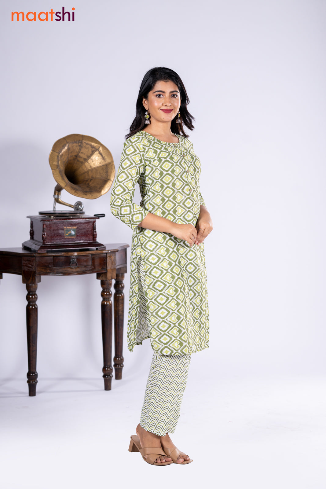 Cotton kurti sap green and off white with allover ikat prints & simple neck pattern and straight cut pant