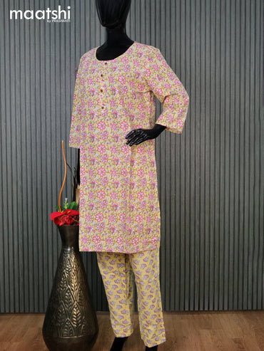 Cotton readymade kurti set pale yellow and pink with allover floral prints & simple neck pattern and straight cut pant