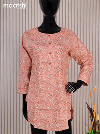 Cotton readymade short kurti peack shade with allover floral prints & simple work neck pattern without pant