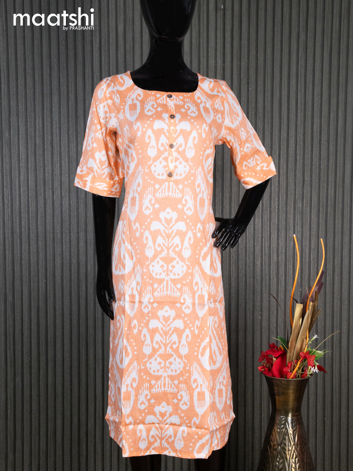 Rayon readymade kurti orange and off white with allover ikat prints & simple neck pattern without pant