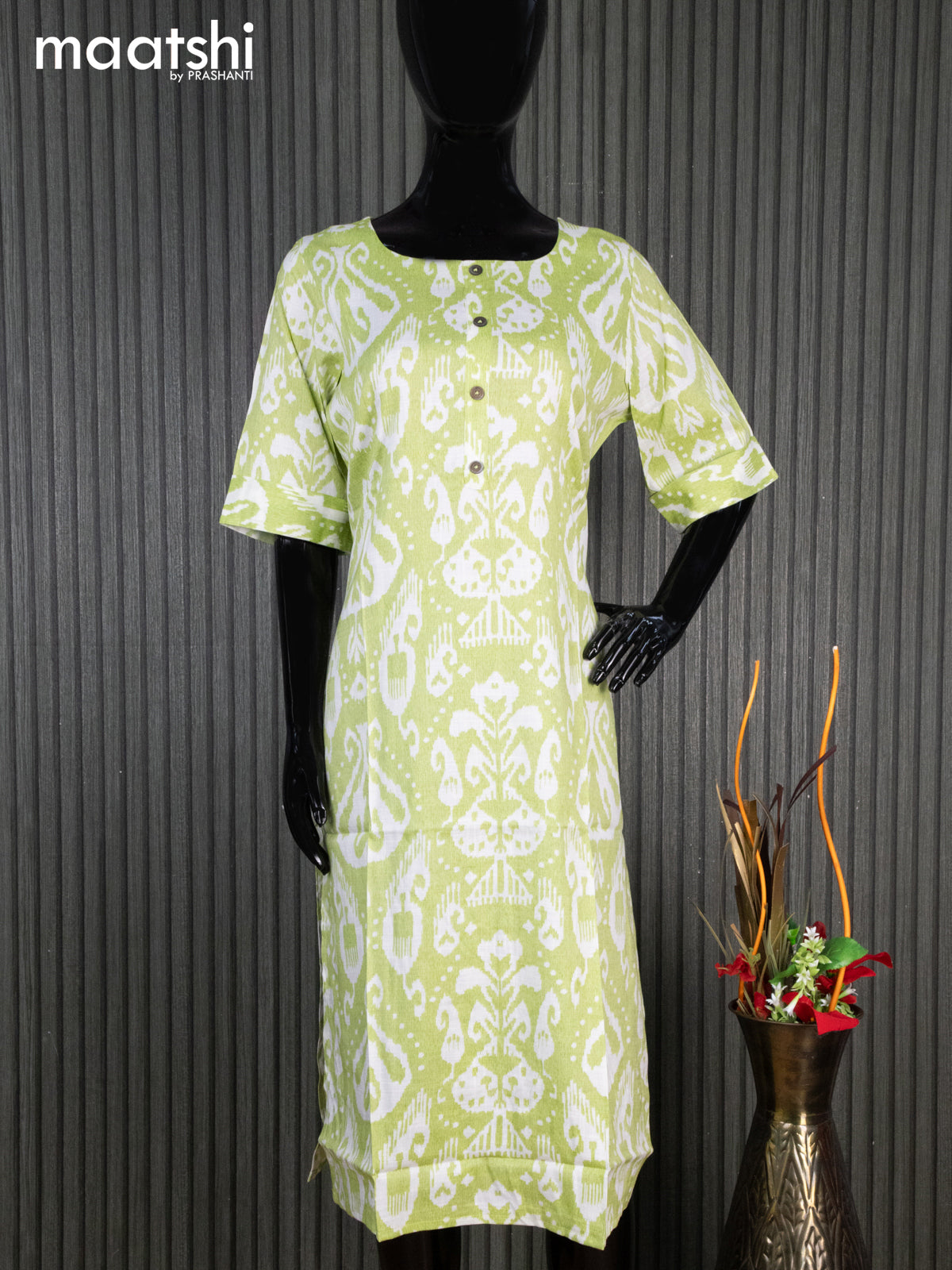 Rayon readymade kurti light green and off white with allover ikat prints & simple neck pattern without pant