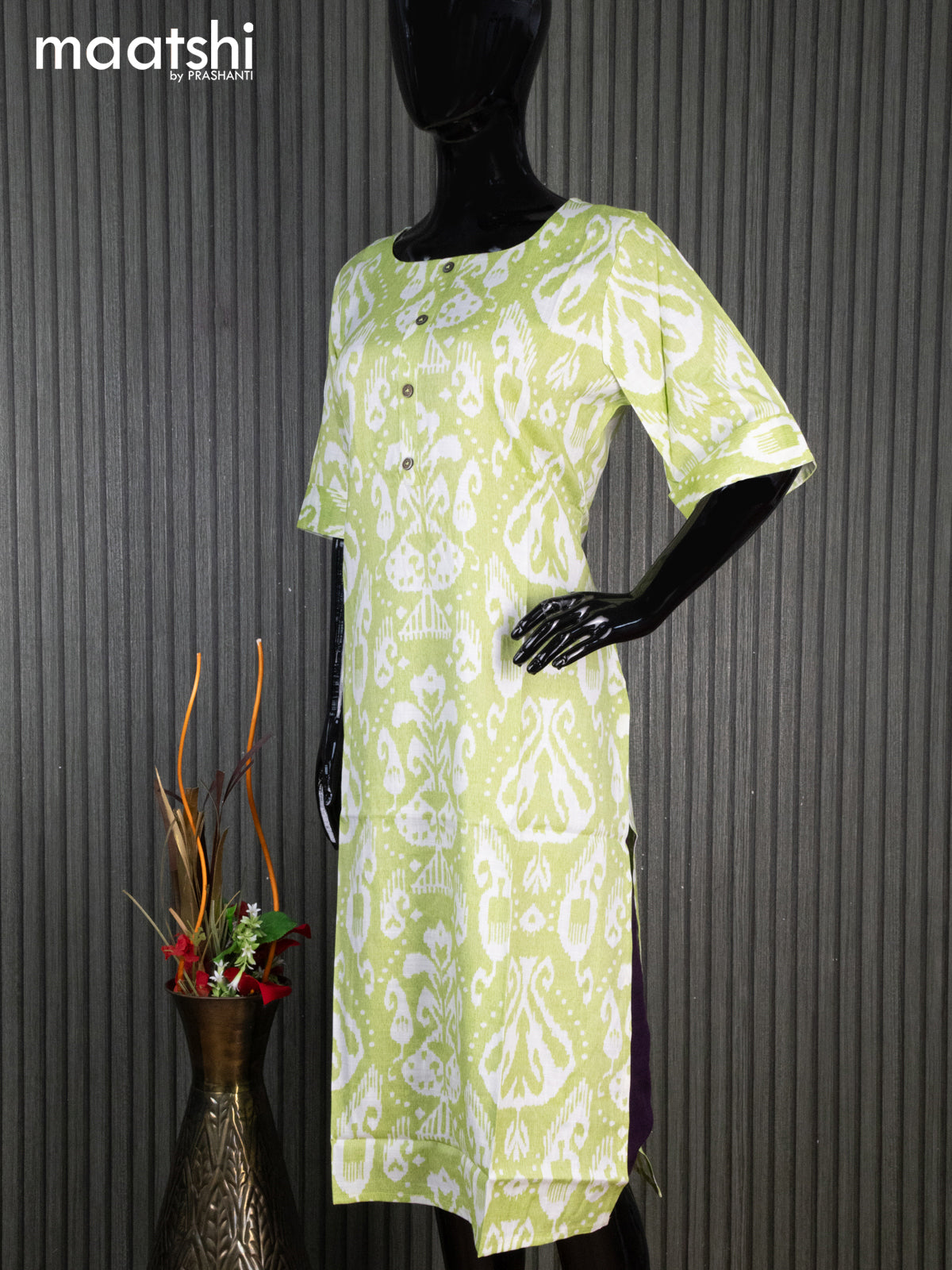 Rayon readymade kurti light green and off white with allover ikat prints & simple neck pattern without pant