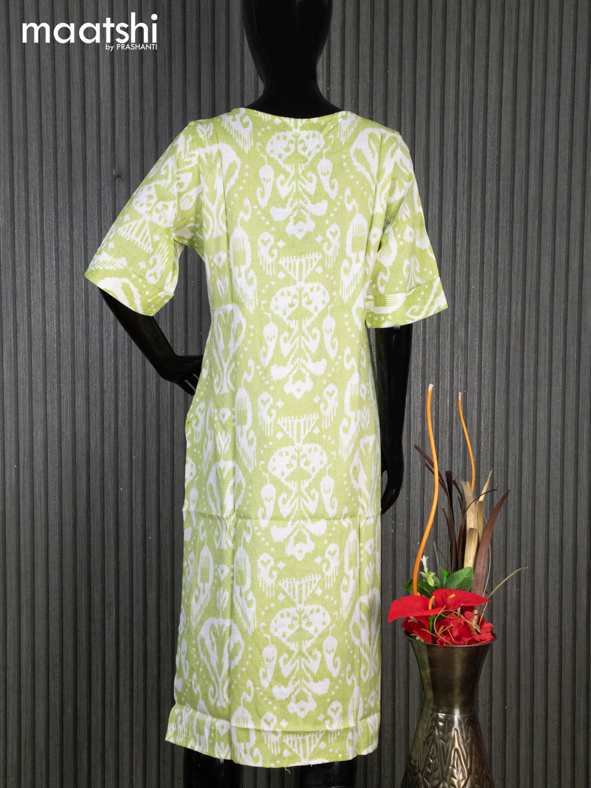 Rayon readymade kurti light green and off white with allover ikat prints & simple neck pattern without pant