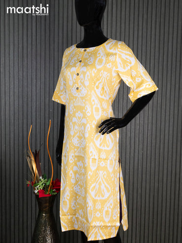 Rayon readymade kurti yellow and off white with allover ikat prints & simple neck pattern without pant