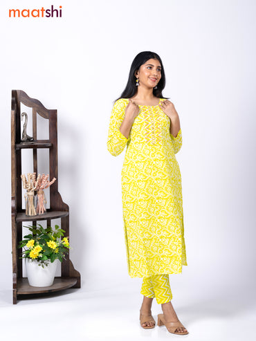 Cotton readymade kurti set fluorescent green and off white with allover floral prints & embroidery mirror work neck pattern and straight cut pant