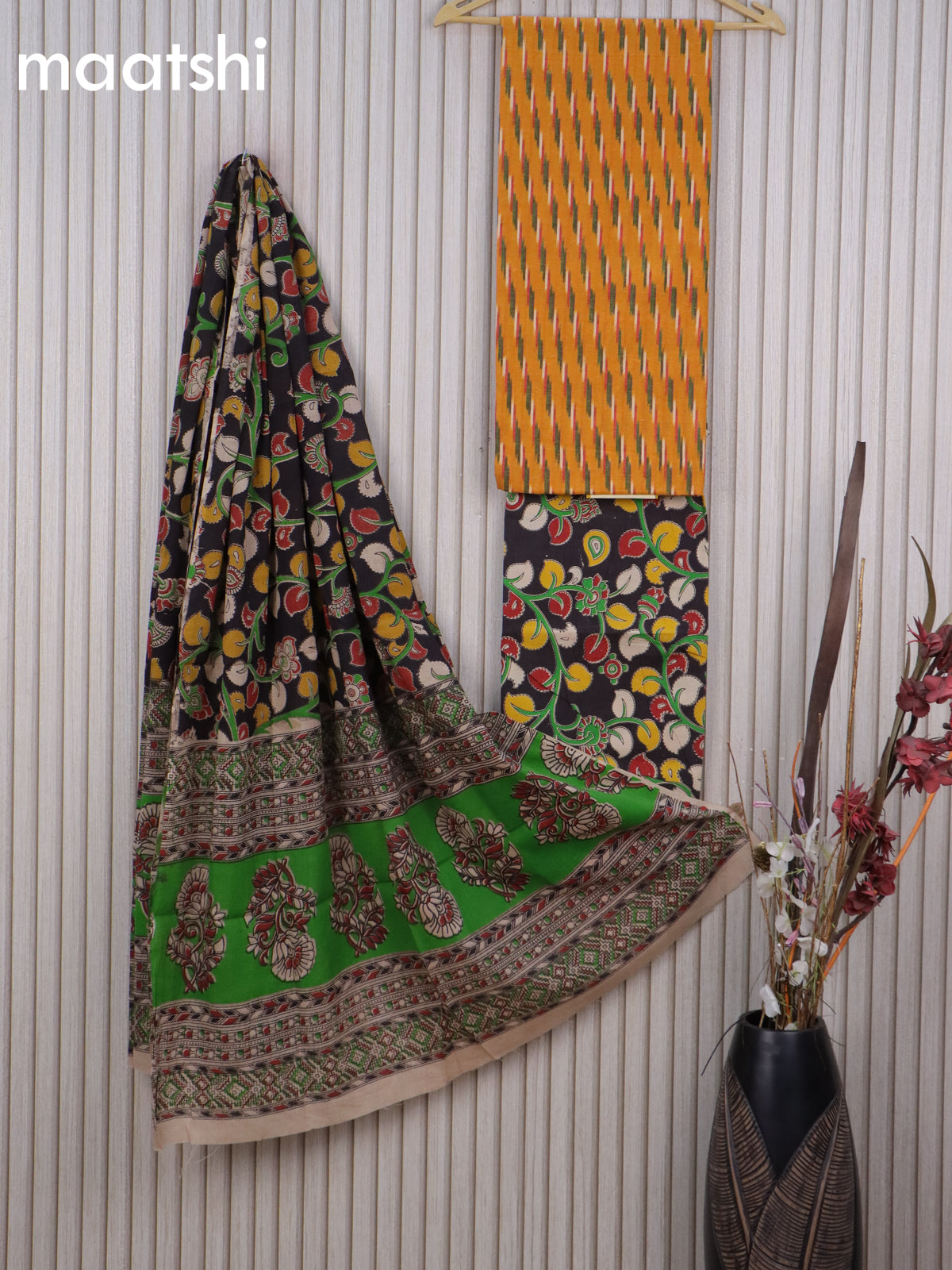 Cotton dress material mustard yellow and black with allover ikat weaves and kalamkari bottom & dupatta