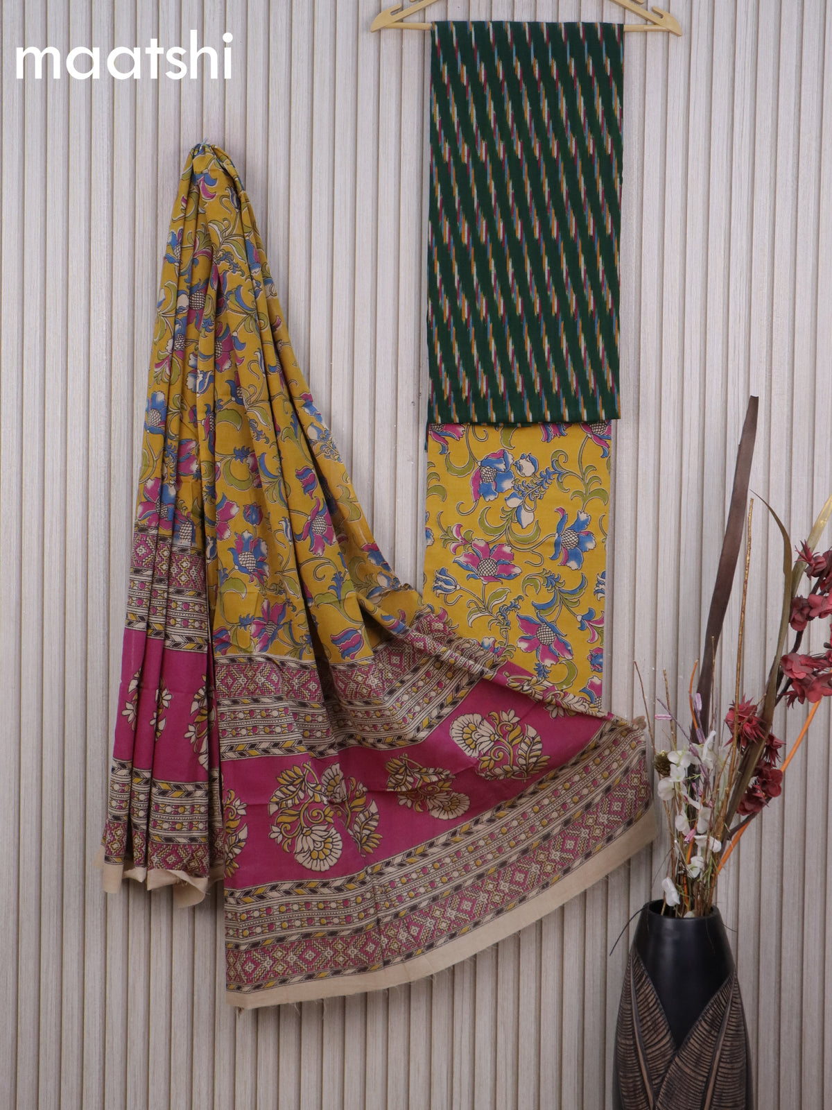 Cotton dress material dark green and musatrd yellow with allover ikat weaves and kalamkari bottom & dupatta