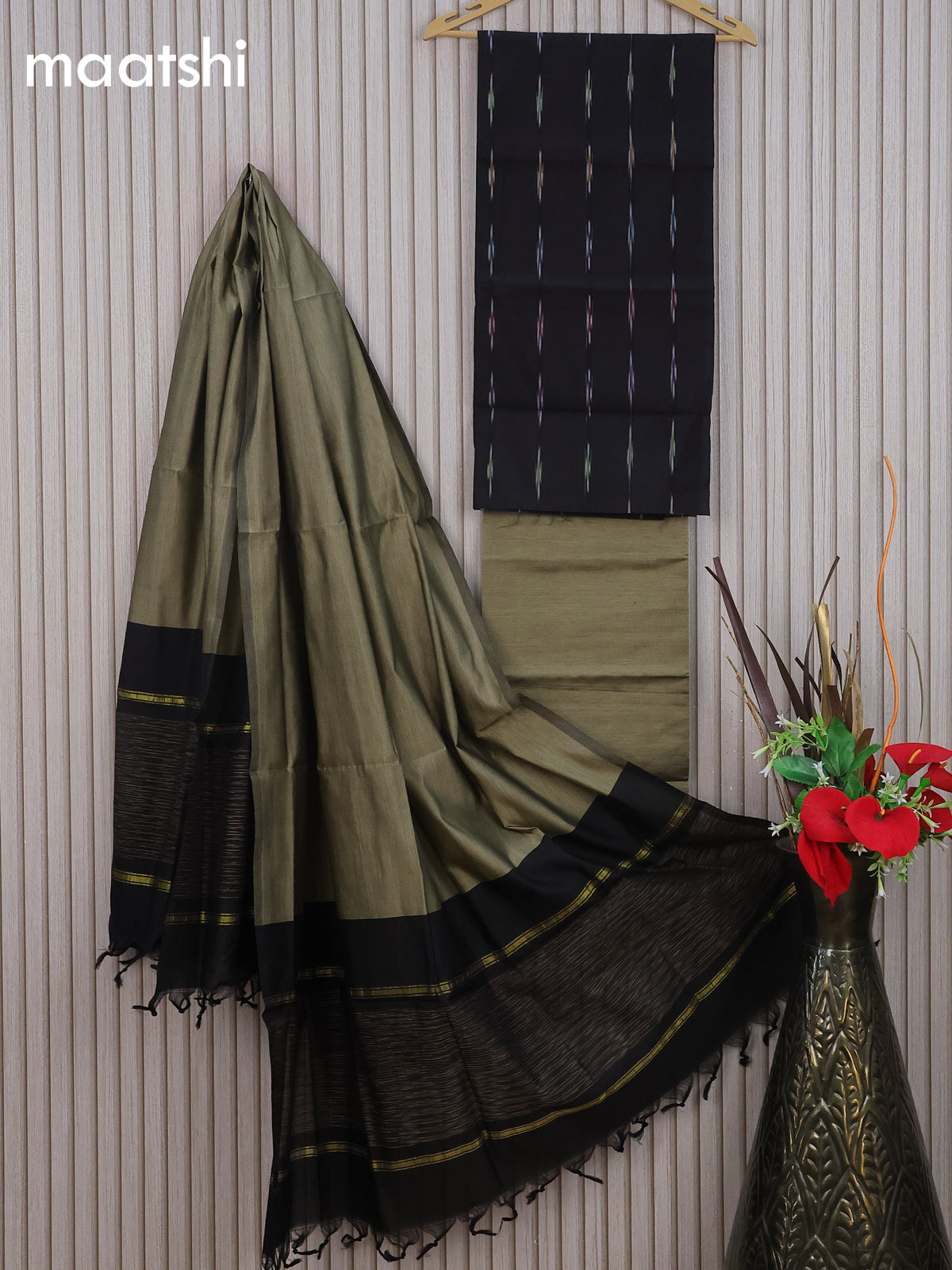 Ikat dress material black and elaichi green with allover ikat weaves and bottom & dupatta