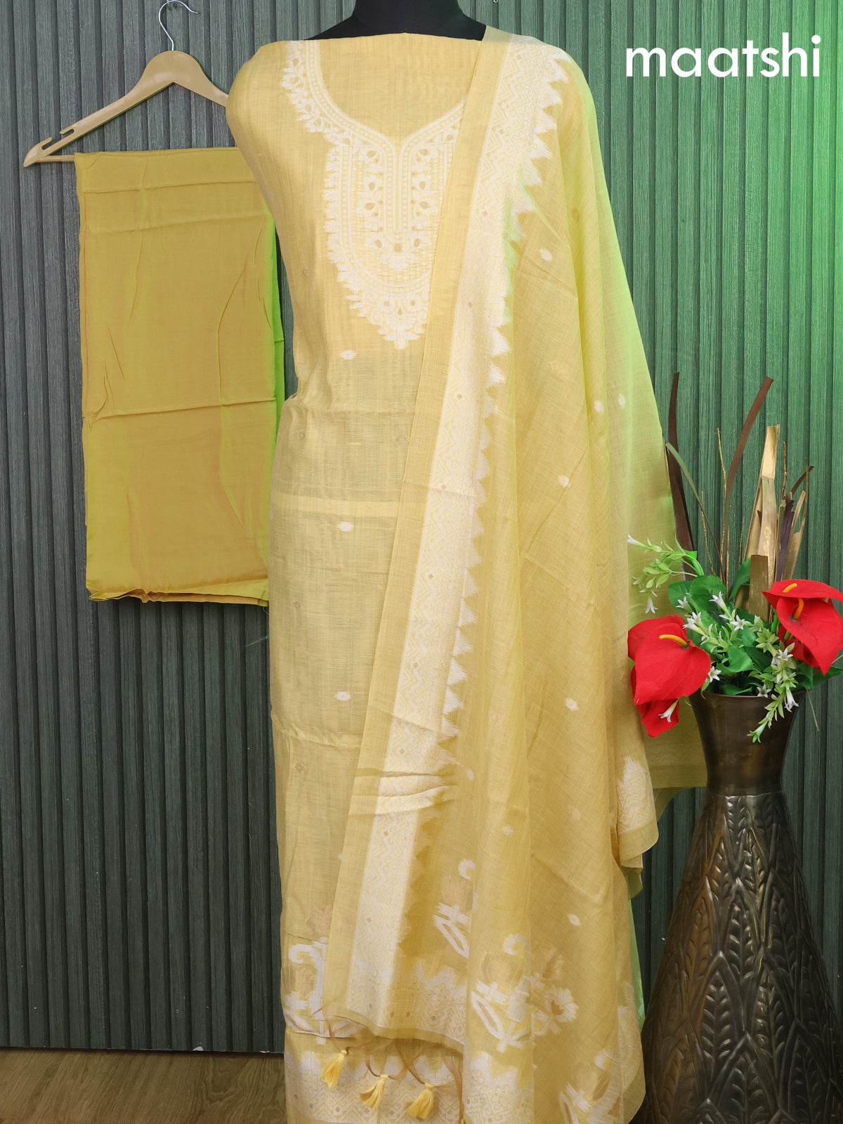 Munga cotton dress material pale yellow with thread & zari woven ikat buttas & simple neck pattern and bottom & thread woven dupatta