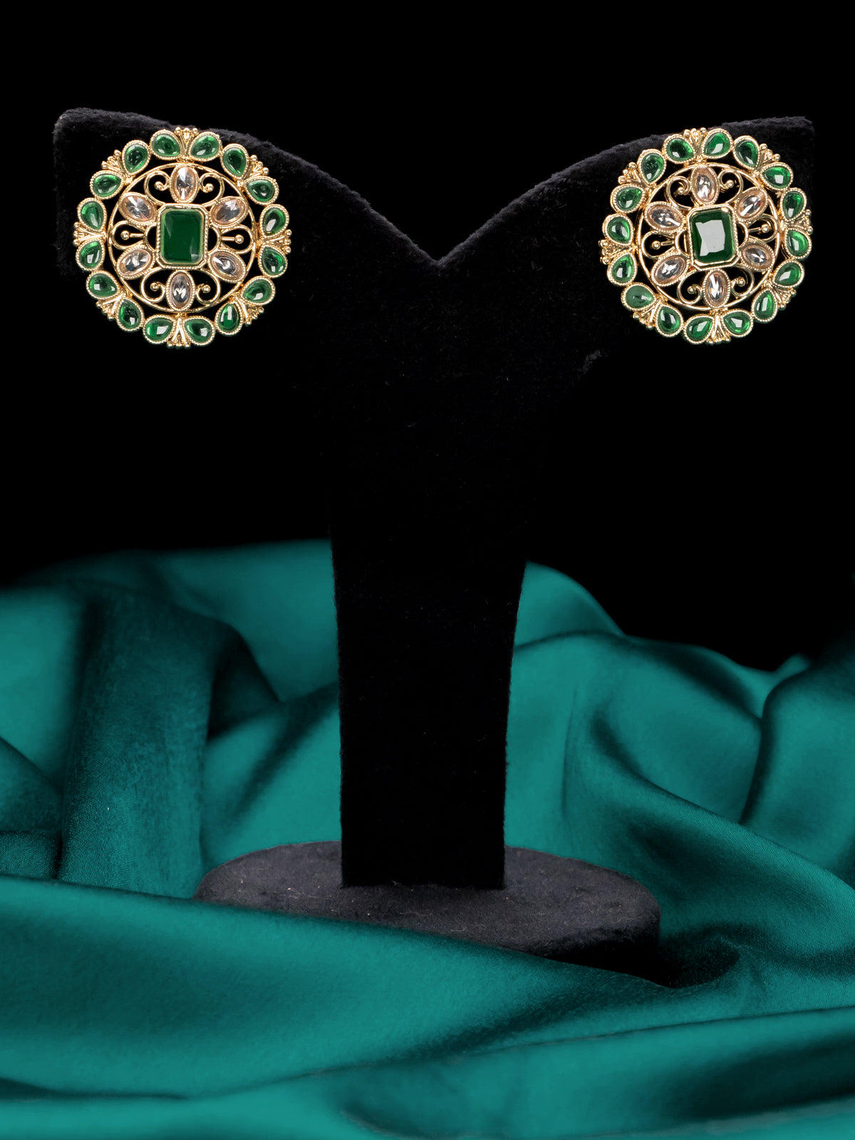 Light weight floral design earrings with emerald and white stones