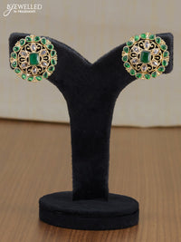 Light weight floral design earrings with emerald and white stones