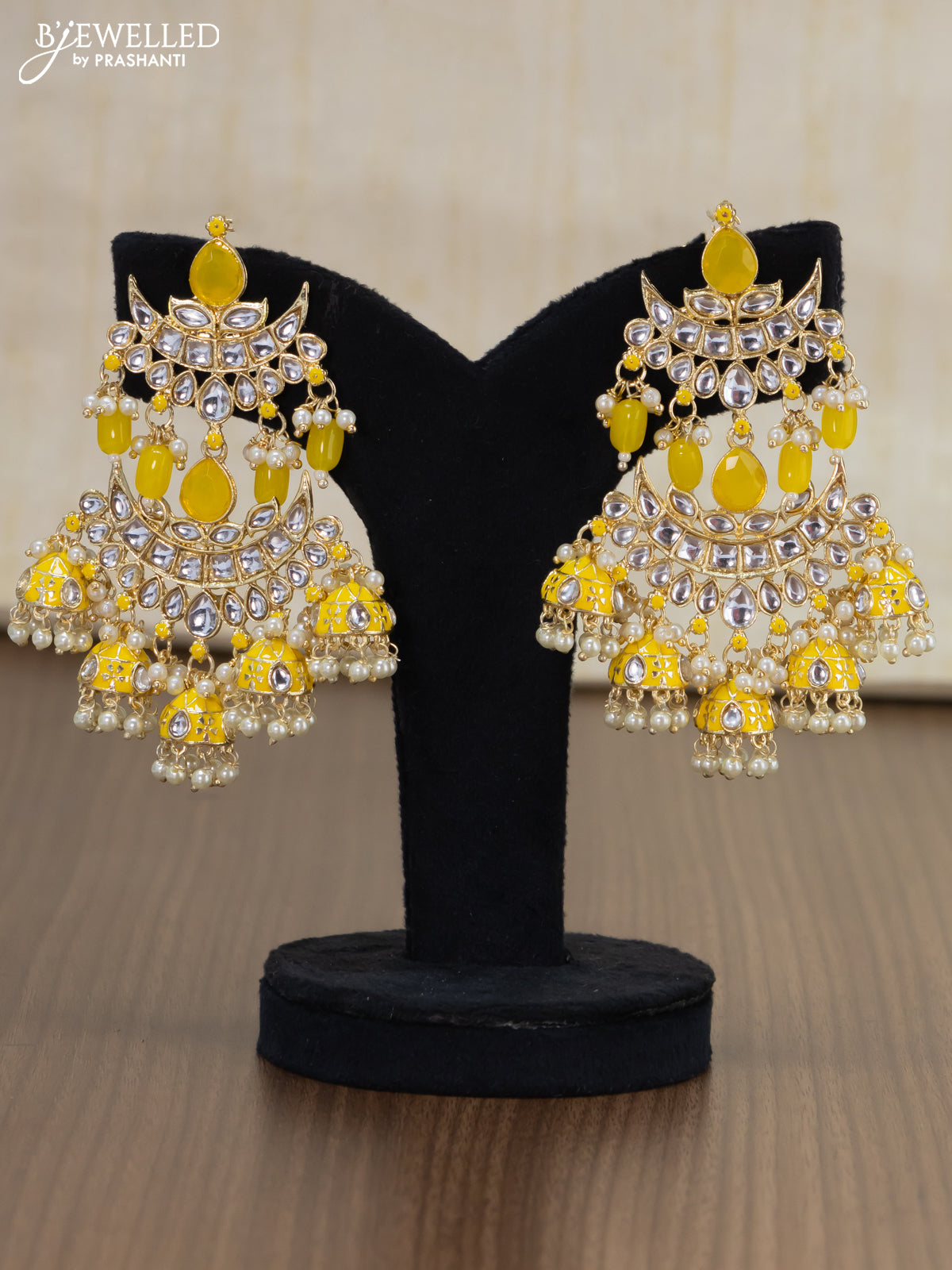 Light weight earrings yellow and kundan stones with pearl maatal