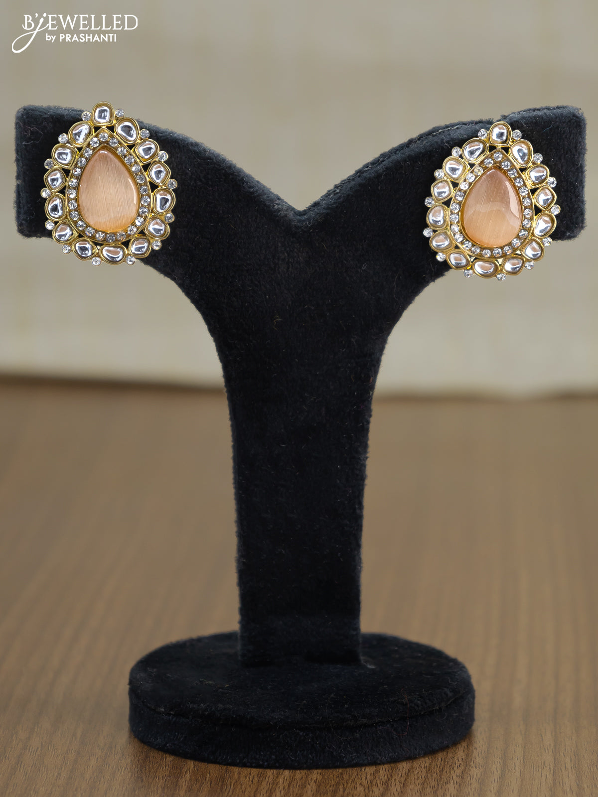 Light weight earrings with cz and peach stone