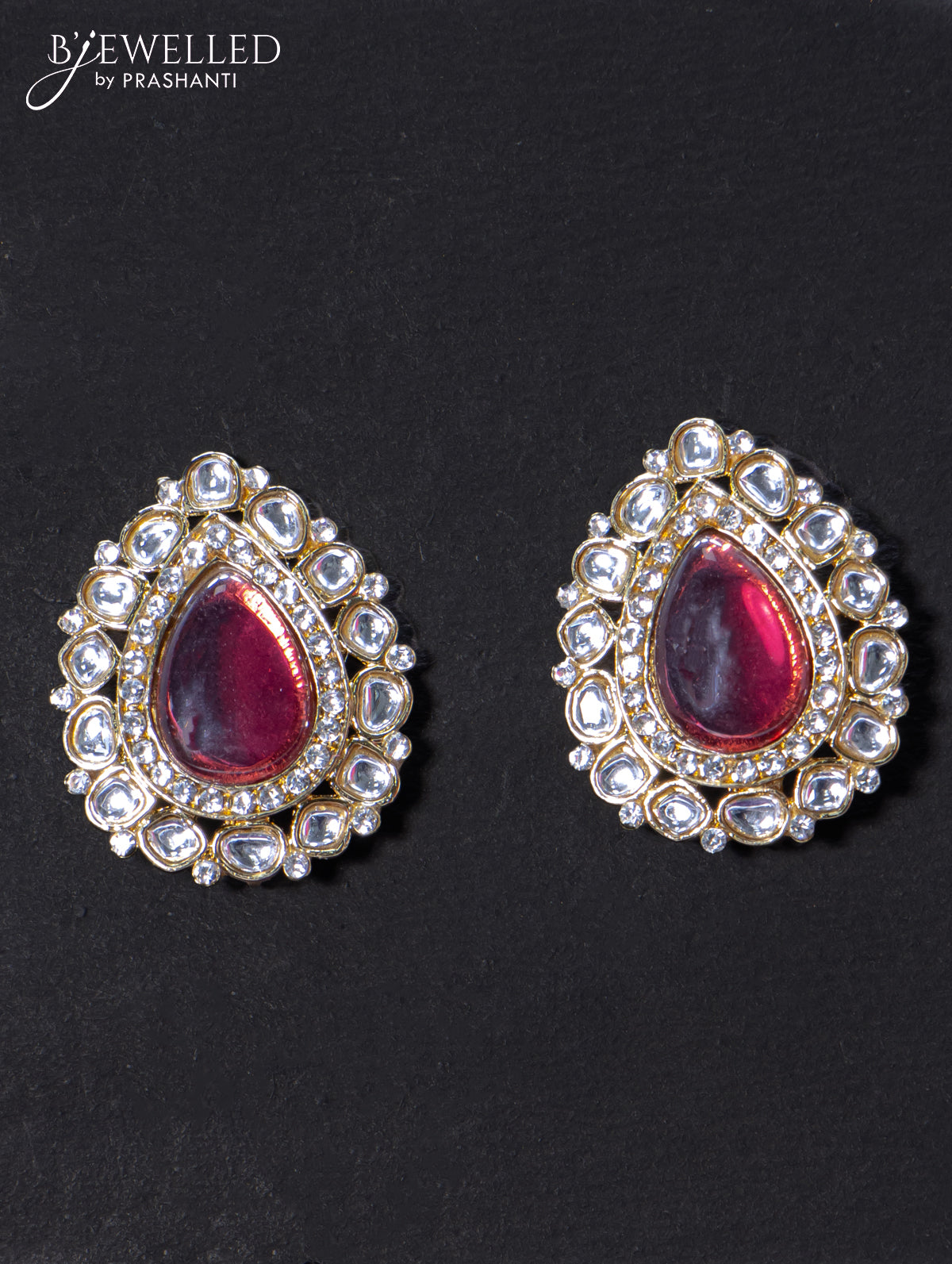 Light weight earrings with cz and red shade stone