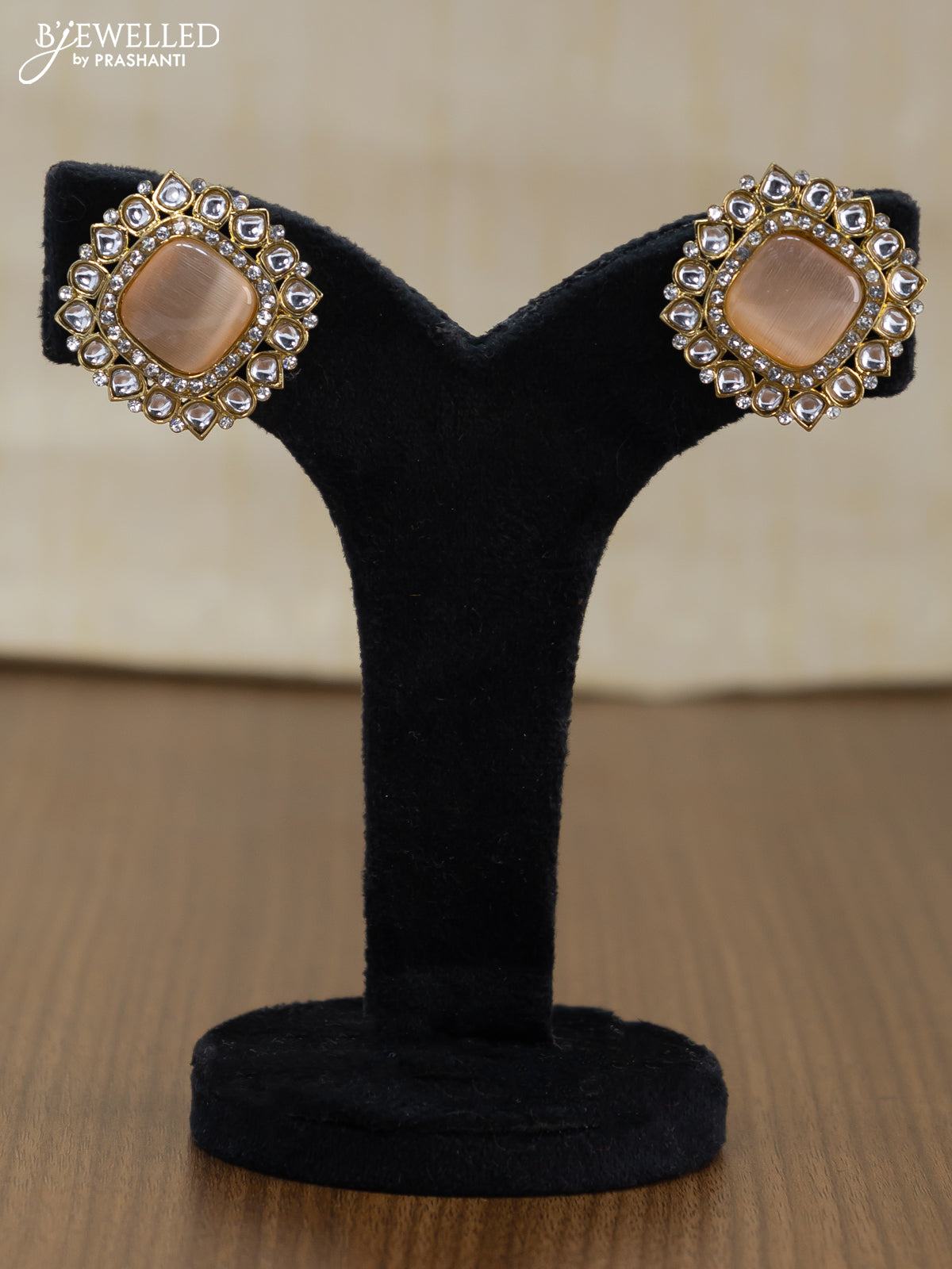 Light weight earrings with cz and peach stone