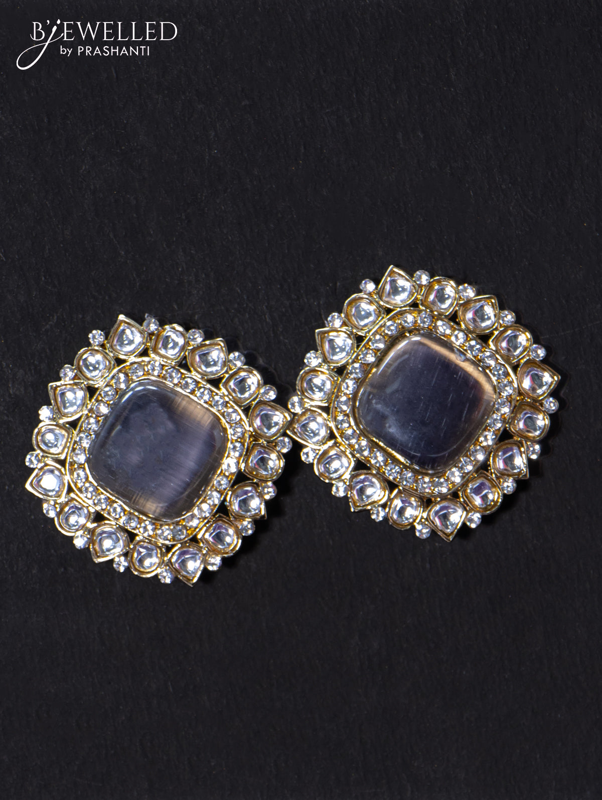 Light weight earrings with cz and grey stone