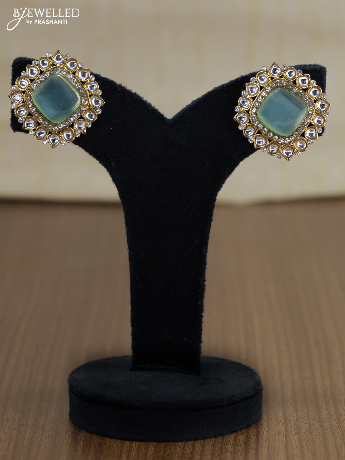 Light weight earrings with cz and mint green stone