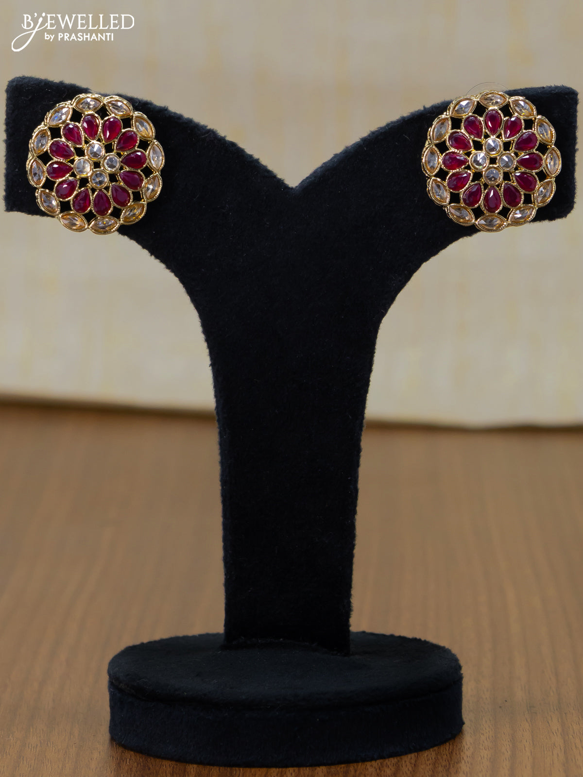 Light weight floral design earrings with cz and maroon stone