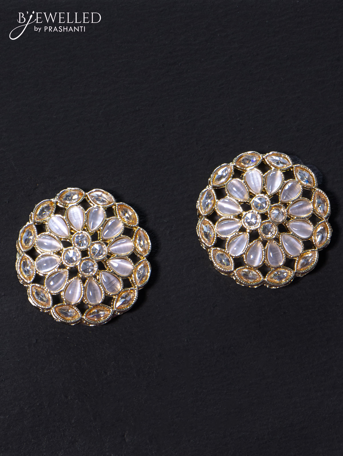 Light weight floral design earrings with cz and white stone