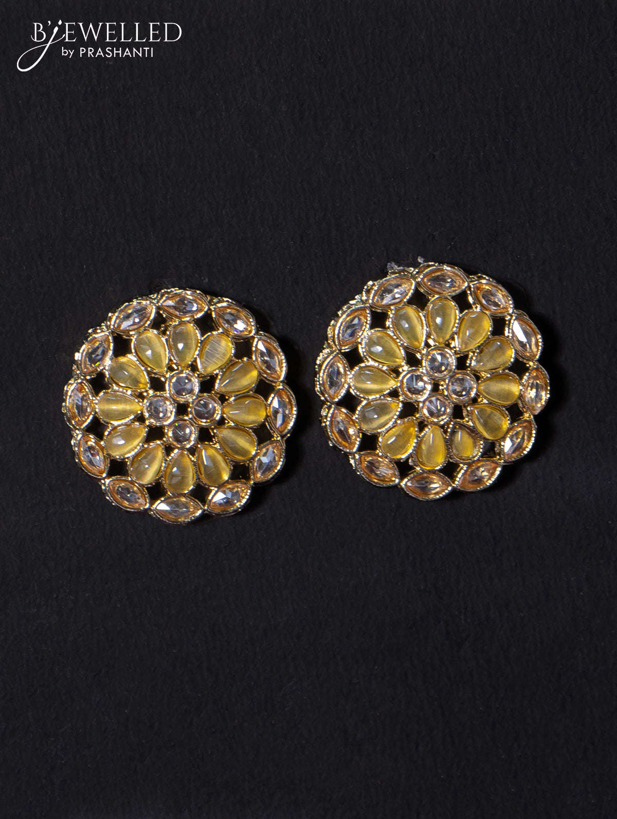 Light weight floral design earrings with cz and yellow stone