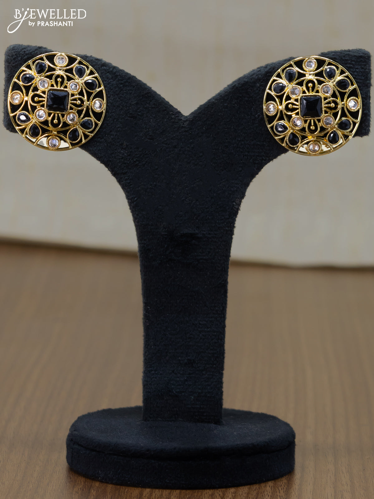 Light weight floral design earrings with cz and black stone