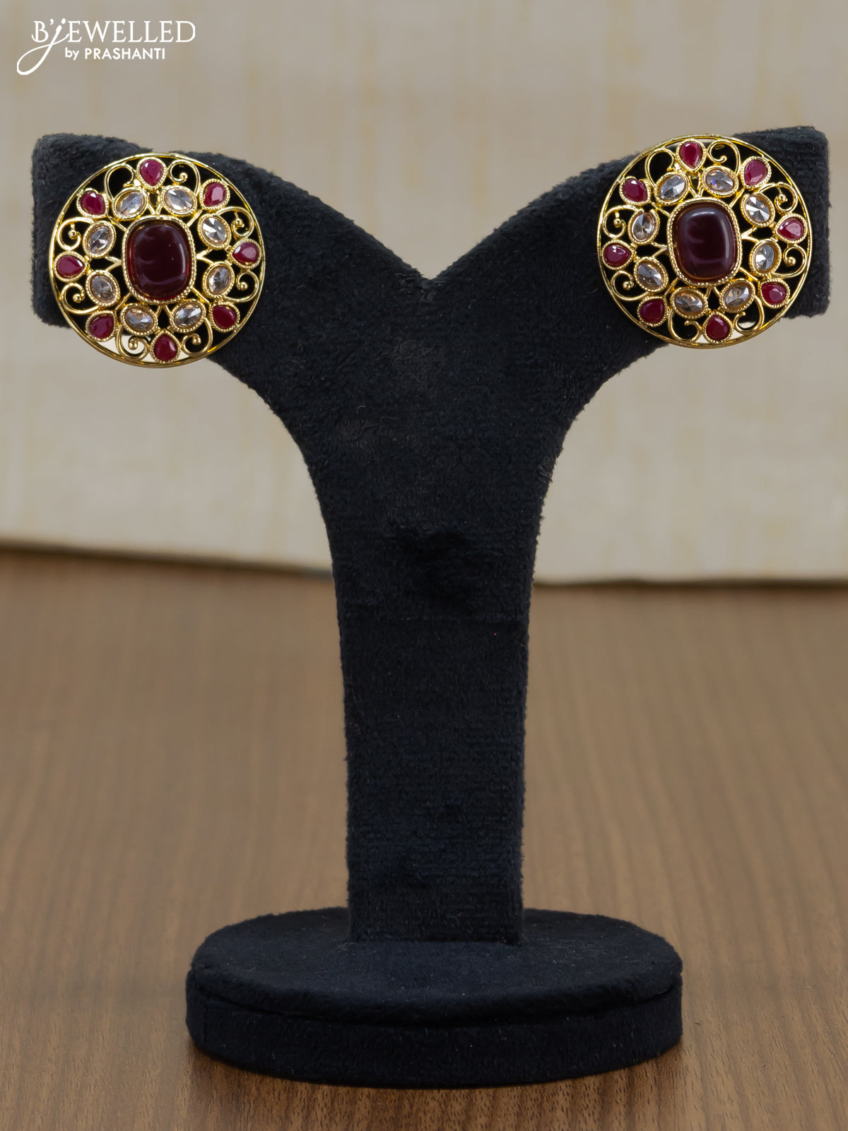 Light weight floral design earrings with cz and maroon stone