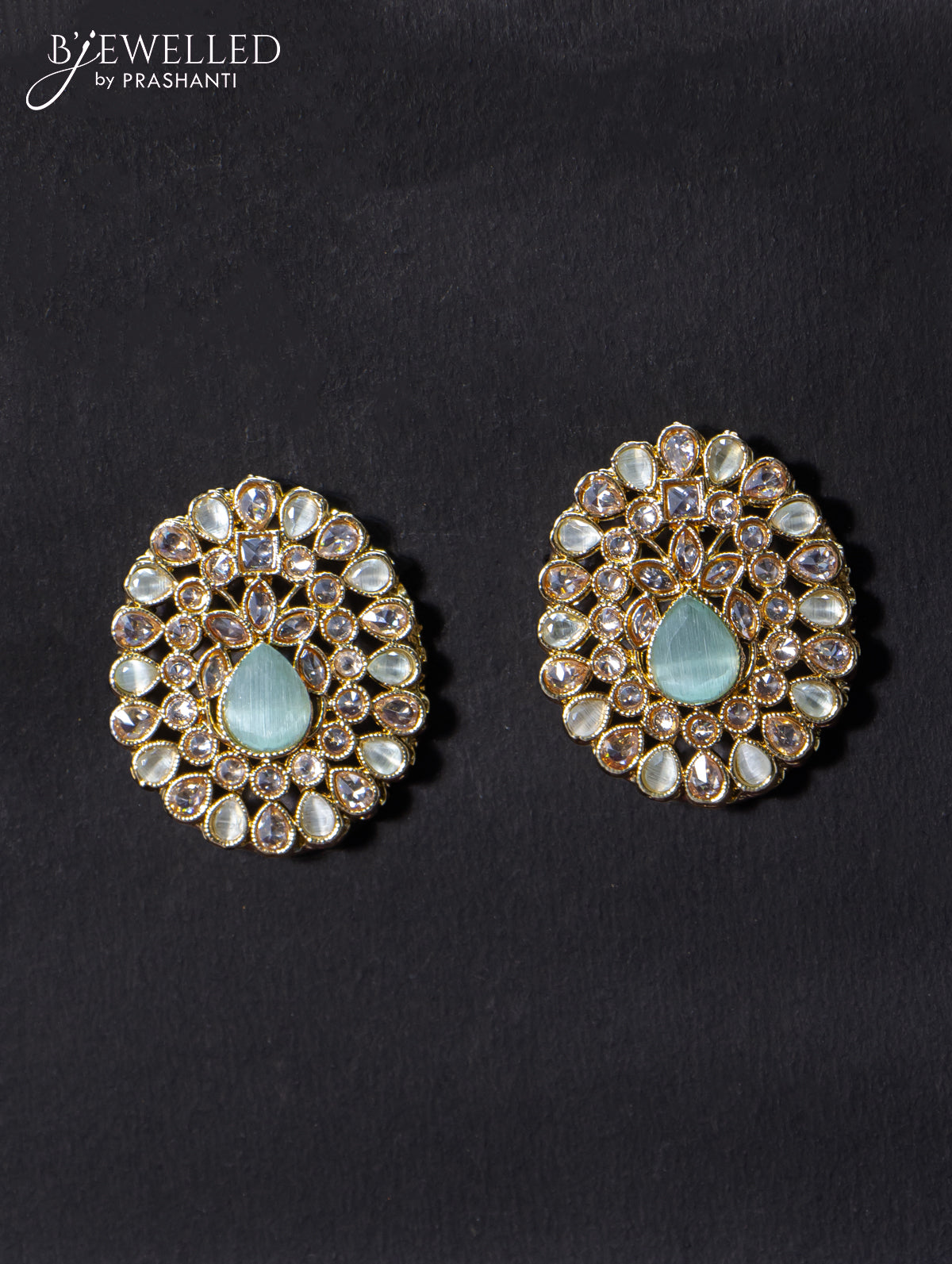 Light weight earrings with cz and mint green stone