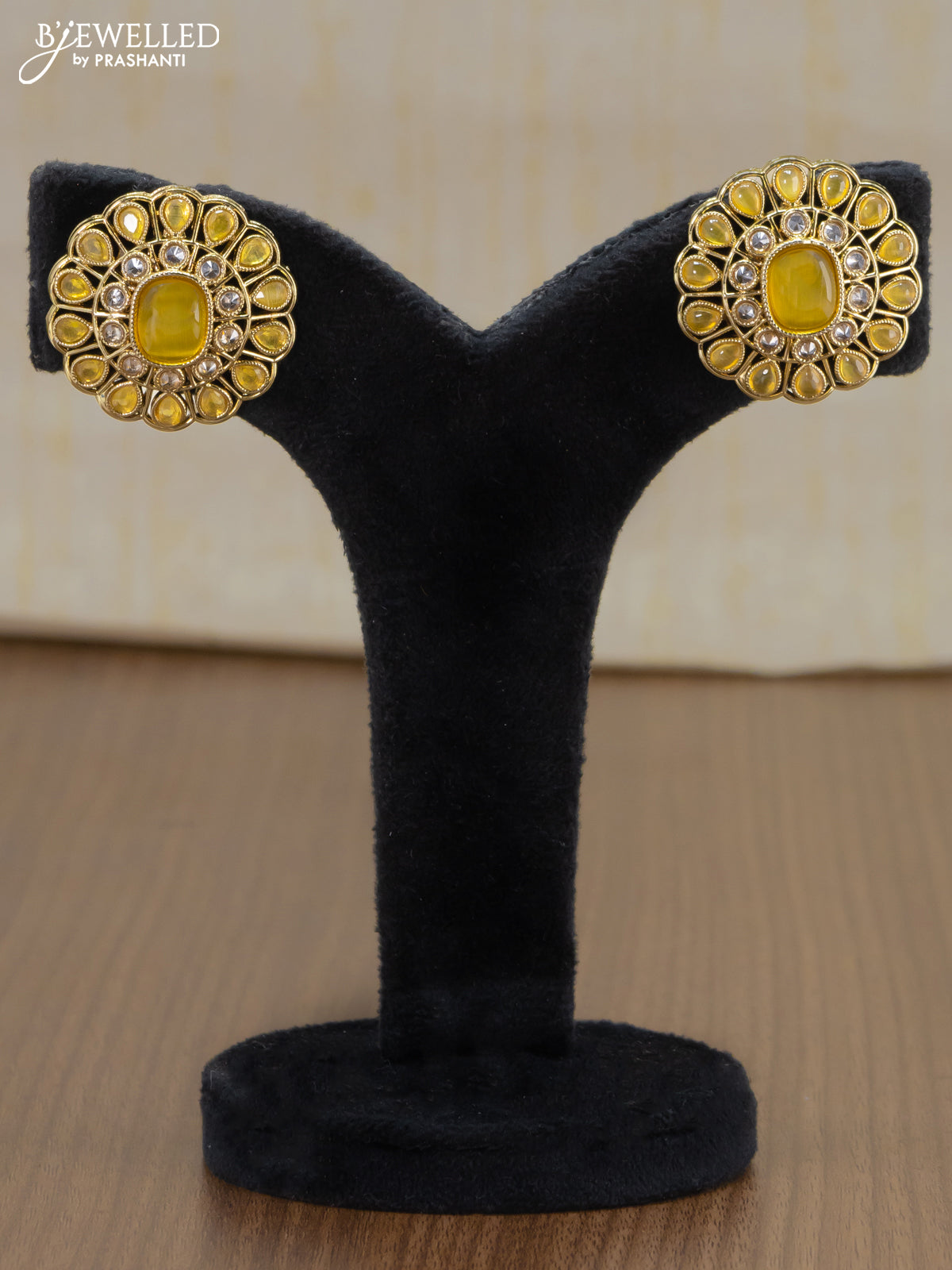 Light weight earrings with cz and yellow stone