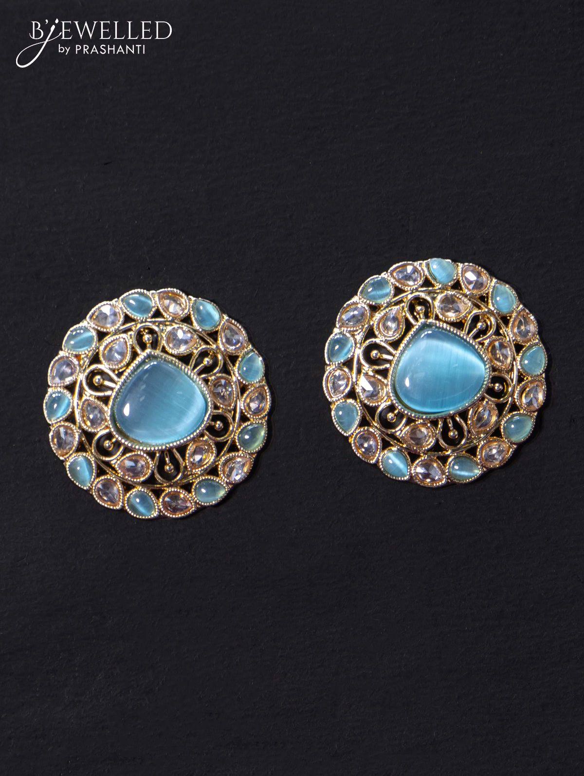 Light weight earrings with cz and light blue stone