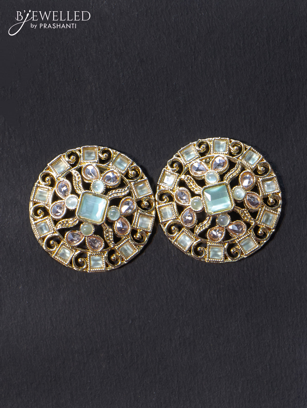 Light weight earrings with cz and mint green stone