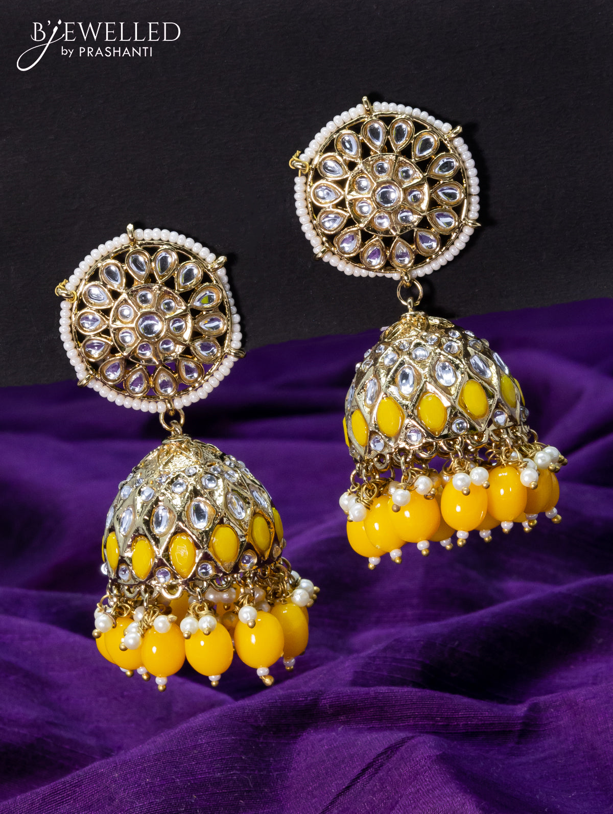 Light weight jhumkas yellow and cz stone with beads hangings