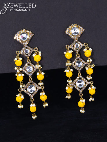 Light weight earrings with cz stone and yellow beads hangings