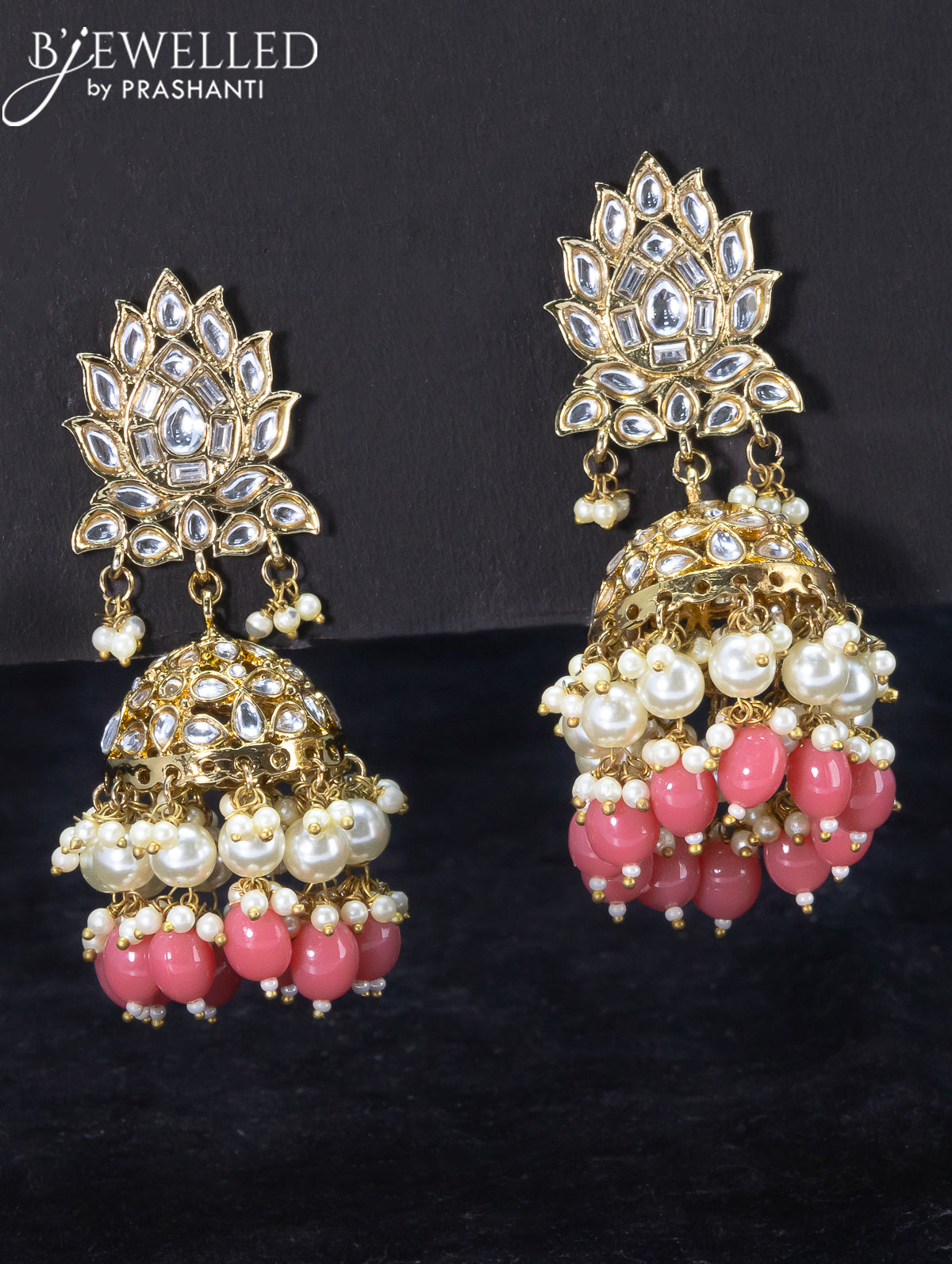 Light weight jhumka with kundan stones and peach pink beads hangings