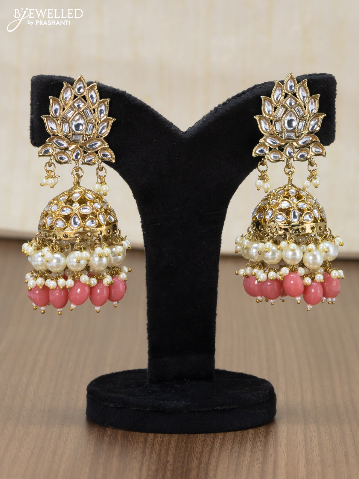 Light weight jhumka with kundan stones and peach pink beads hangings