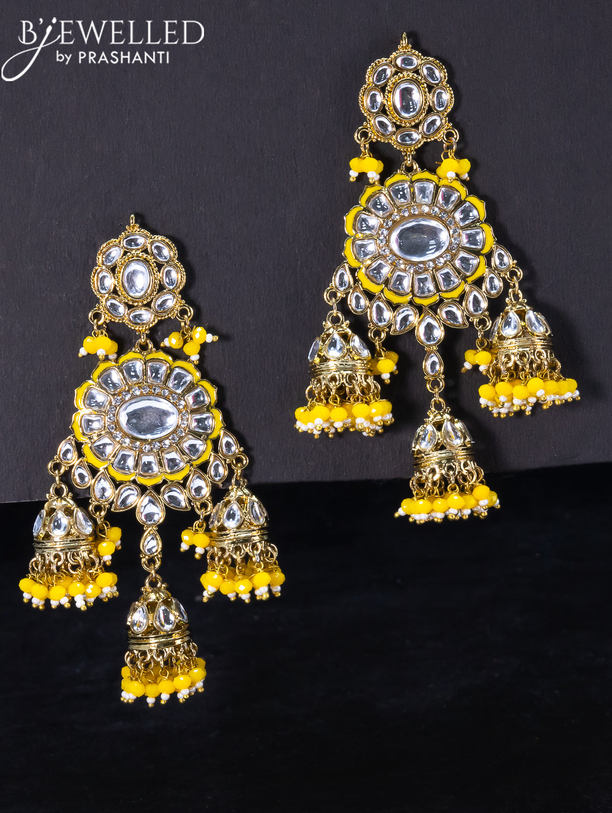 Light weight jhumka with kundan stones and yellow beads hangings