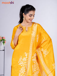 Crepe silk salwar suit mango yellow with placement prints & beaded work neck pattern and straight cut pant & dupatta