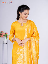 Crepe silk salwar suit mango yellow with placement prints & beaded work neck pattern and straight cut pant & dupatta