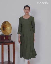 Rayon A-line kurti sap green and with beaded embroidery work neck pattern and without pant