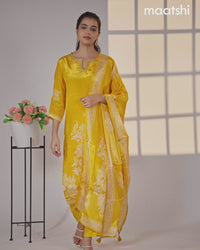 Crepe silk salwar suit mango yellow with placement prints & beaded work neck pattern and straight cut pant & dupatta