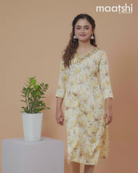 Cotton readymade kurti pale yellow with allover prints & embroidery mirror work v neck pattern without pant