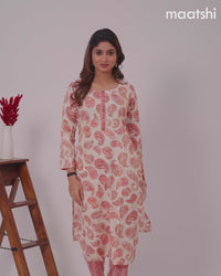 Rayon kurti set cream and red shade with allover paisley prints & simple neck pattern and straight cut pant