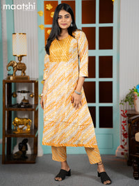 Cotton readymade anarkali kurti yellow shade with allover floral prints & sequin embroidery work neck pattern and straight cut pant